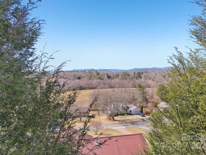 127 Kalmia Terrace Court, Hendersonville, NC 28739.  MLS# CAR4227852, YatesRealty ID 5821. With a little tree trimming this could be a massive long range view