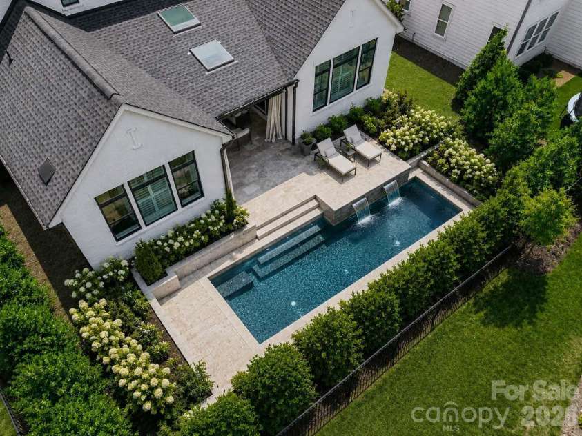 4031 Pritchard Place, Fort Mill, SC 29715.  MLS# CAR4391499, YatesRealty ID 5821. Aerial Backyard Left Imagined with Pool AI