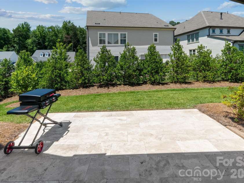 4031 Pritchard Place, Fort Mill, SC 29715.  MLS# CAR4391499, YatesRealty ID 5821. Spacious Travertine patio