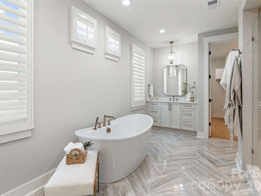 4031 Pritchard Place, Fort Mill, SC 29715.  MLS# CAR4391499, YatesRealty ID 5821. Tub with Second Vanity Primary Bath