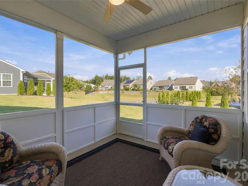 3162 Windhaven Lane, Tega Cay, SC 29708.  MLS# CAR4434420, YatesRealty ID 58210. Screened Patio overlooking lush landscape with irrigation system
