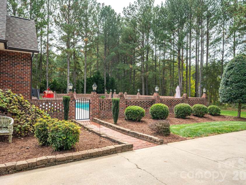2750 Arbor Hills Drive, Lincolnton, NC 28092.  MLS# CAR4426870, YatesRealty ID 58224. Brick Fenced Inground Pool