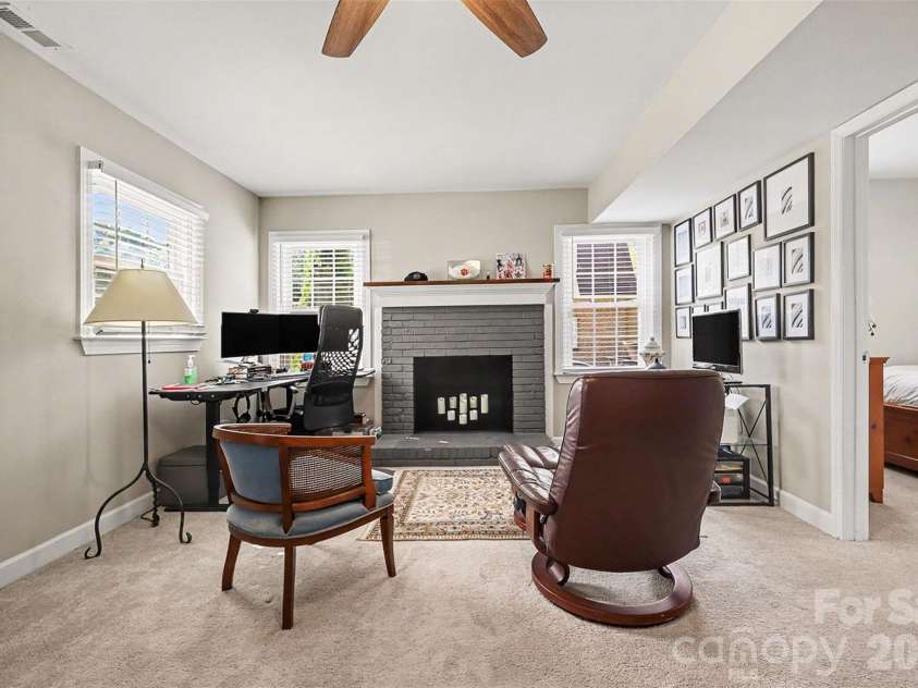 5621 Alanhurst Place, Charlotte, NC 28217.  MLS# CAR4424544, YatesRealty ID 58226. Den and Fireplace