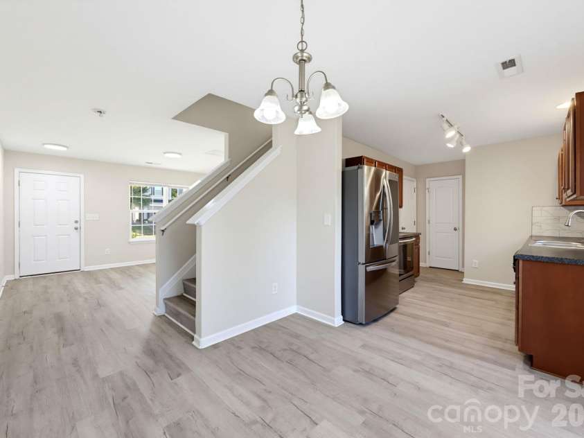 5718 Natick Drive, Charlotte, NC 28214.  MLS# CAR4430694, YatesRealty ID 58232. Open layout connecting the living area and kitchen, creating a comfortable space for everyday living and entertaining.
