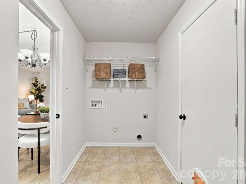 1901 Beckwith Lane, Waxhaw, NC 28173.  MLS# CAR4436790, YatesRealty ID 58239. Laundry room between garage and kitchen.