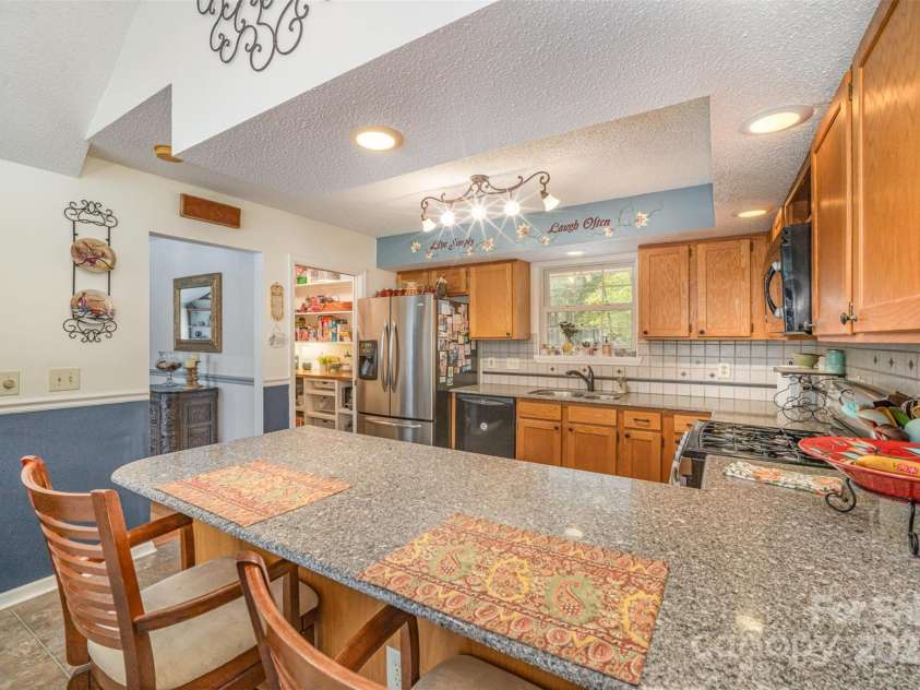 15450 Millview Trace Lane, Mint Hill, NC 28227.  MLS# CAR4195517, YatesRealty ID 5826. Kitchen Featuring Granite Countertops