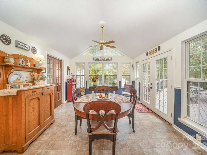 15450 Millview Trace Lane, Mint Hill, NC 28227.  MLS# CAR4195517, YatesRealty ID 5826. Sunroom Featuring Natural Lighting & Walk-Out Access to the Deck
