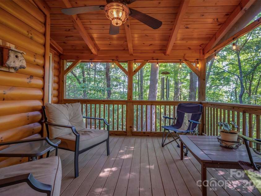 136 Knob Lane, Lake Lure, NC 28746.  MLS# CAR4177604, YatesRealty ID 5831. Screened Porch is the perfect spot for your morning coffee and to enjoy the sounds of nature