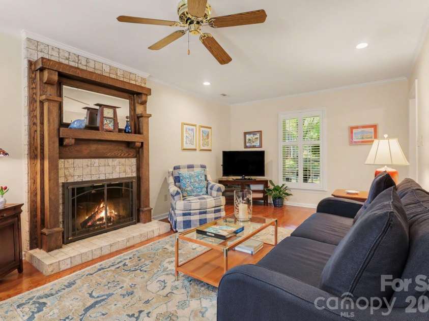 640 Heather Lane, Charlotte, NC 28209.  MLS# CAR4435553, YatesRealty ID 58325. Comfortable living room. Please note, fire shown in fireplace is virtually added.