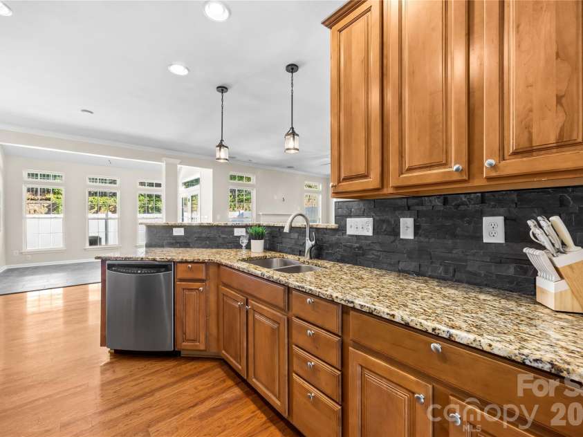 156 Arcadian Way, Mooresville, NC 28117.  MLS# CAR4434144, YatesRealty ID 58331. Granite, tile backsplash, and pullout shelves!