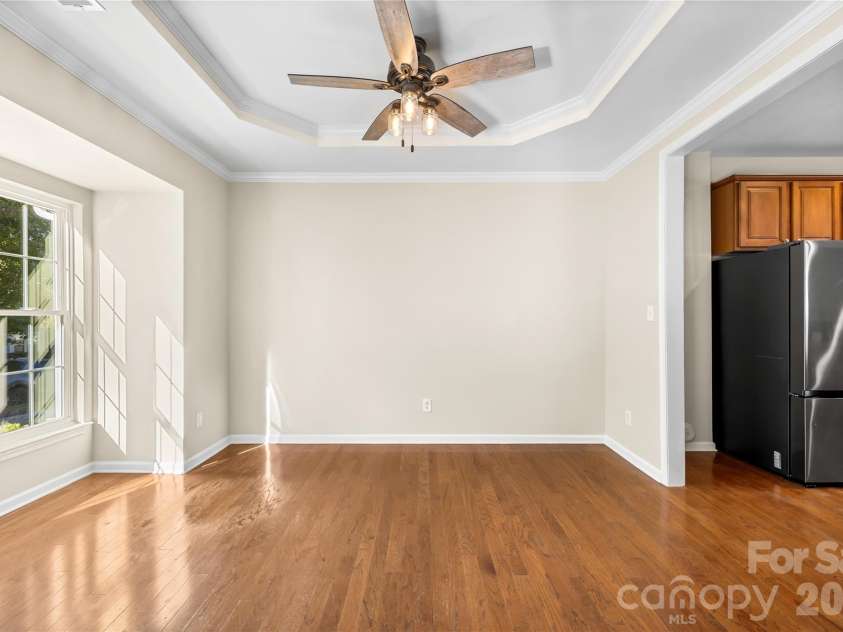 156 Arcadian Way, Mooresville, NC 28117.  MLS# CAR4434144, YatesRealty ID 58331. The dining room has a bay window and a tray ceiling.