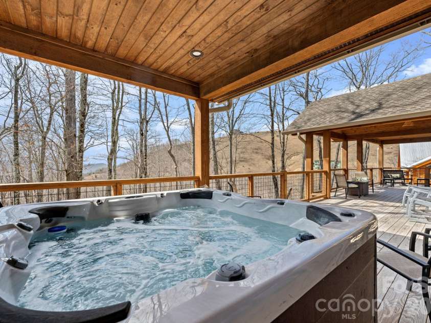 204 Great Sky Drive, Banner Elk, NC 28604.  MLS# CAR4358652, YatesRealty ID 5836. Hot tub under covered deck