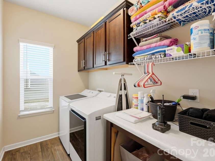 4509 Bent Green Lane, Monroe, NC 28112.  MLS# CAR4436416, YatesRealty ID 58375. Laundry with folding area & storage