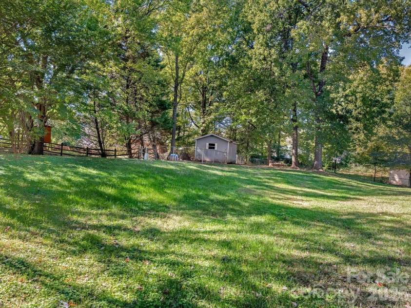 1100 Dark Wood Court, Matthews, NC 28105.  MLS# CAR4436676, YatesRealty ID 58403. Backyard