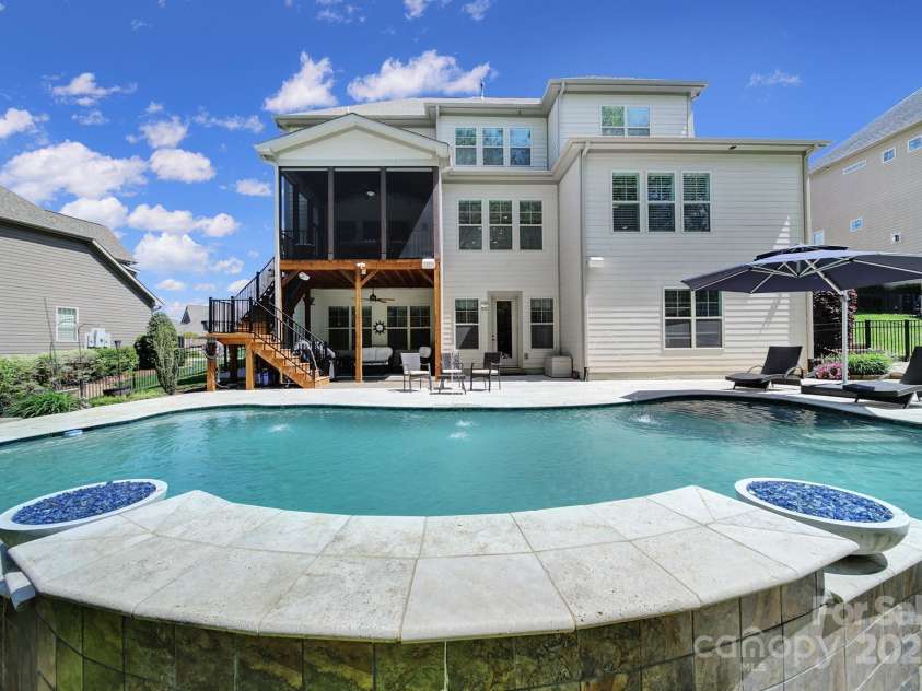 141 Forsythia Lane, Tega Cay, SC 29708.  MLS# CAR4243630, YatesRealty ID 5841. Pool Side w/ Gas Fire pits