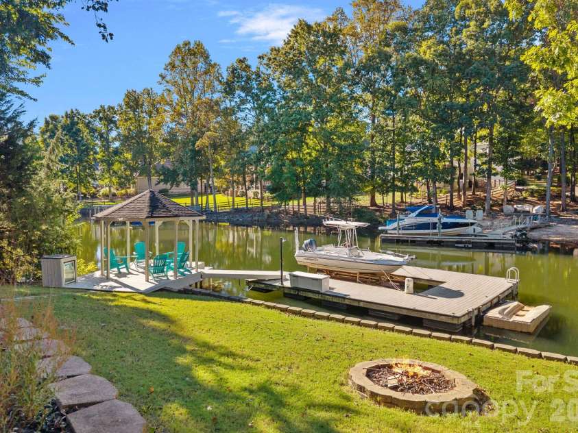 148 Sunrise Circle, Mooresville, NC 28117.  MLS# CAR4432161, YatesRealty ID 58439. Another firepit in the grass area