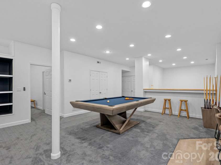 148 Sunrise Circle, Mooresville, NC 28117.  MLS# CAR4432161, YatesRealty ID 58439. Extra space for a pool table and additional flex space beyond the bar area