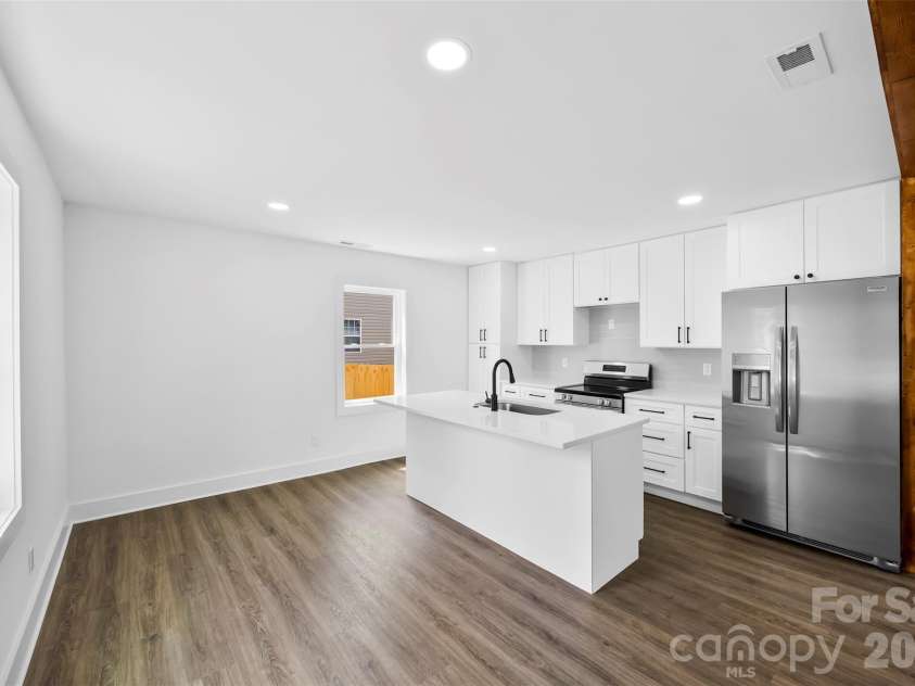 2942 Reid Avenue, Charlotte, NC 28208.  MLS# CAR4437077, YatesRealty ID 58487. Dining area off the kitchen.