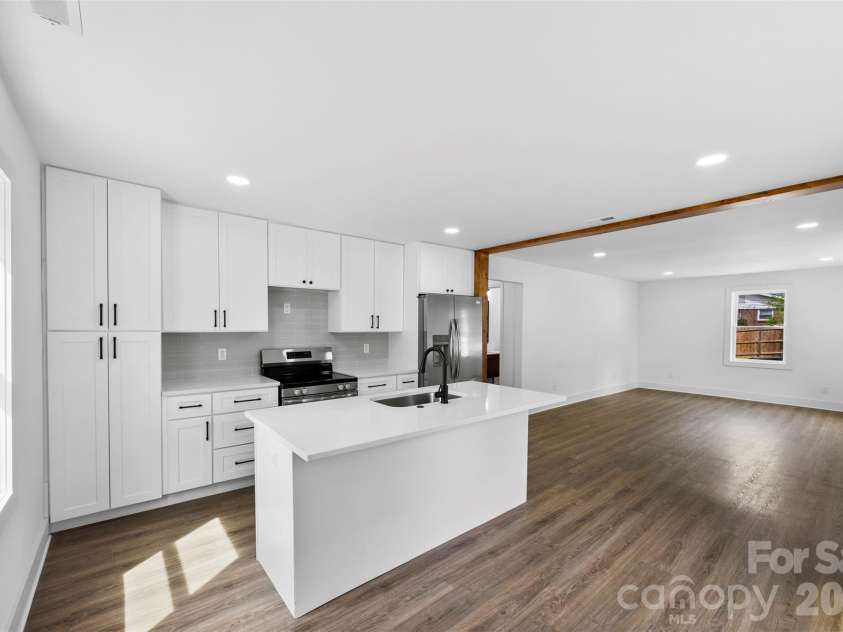 2942 Reid Avenue, Charlotte, NC 28208.  MLS# CAR4437077, YatesRealty ID 58487. Large kitchen island.