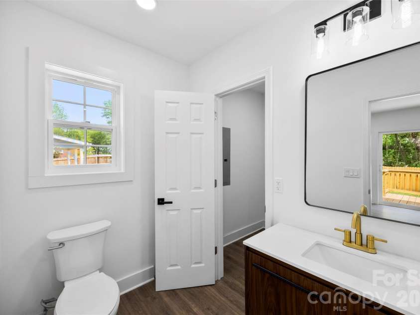 2942 Reid Avenue, Charlotte, NC 28208.  MLS# CAR4437077, YatesRealty ID 58487. Primary bathroom with walk in closet.