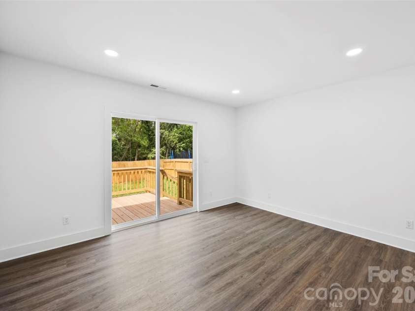 2942 Reid Avenue, Charlotte, NC 28208.  MLS# CAR4437077, YatesRealty ID 58487. Primary bedroom with access to the back deck.