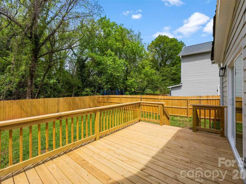 2942 Reid Avenue, Charlotte, NC 28208.  MLS# CAR4437077, YatesRealty ID 58487. Spacious back deck