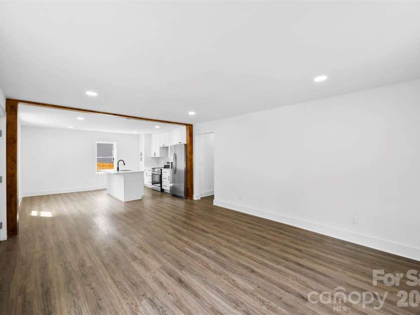 2942 Reid Avenue, Charlotte, NC 28208.  MLS# CAR4437077, YatesRealty ID 58487. Spacious living room.