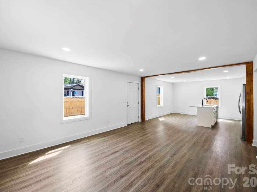 2942 Reid Avenue, Charlotte, NC 28208.  MLS# CAR4437077, YatesRealty ID 58487. Spacious living room.