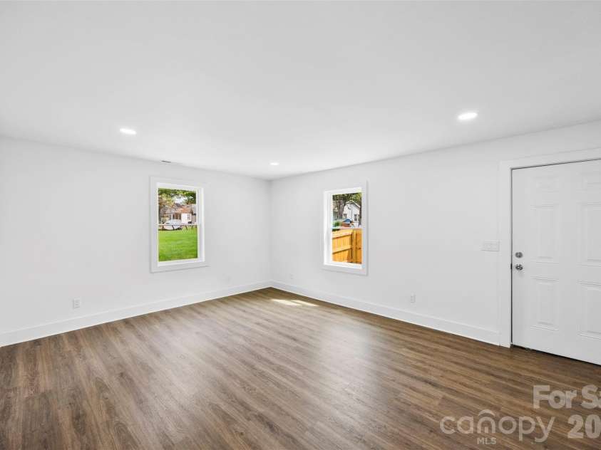 2942 Reid Avenue, Charlotte, NC 28208.  MLS# CAR4437077, YatesRealty ID 58487. Spacious living room.