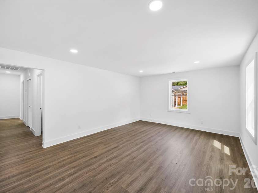 2942 Reid Avenue, Charlotte, NC 28208.  MLS# CAR4437077, YatesRealty ID 58487. Spacious living room.