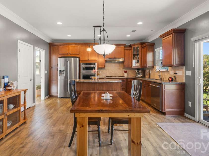 1232 New River Drive, Concord, NC 28025.  MLS# CAR4436783, YatesRealty ID 58494. Spacious kitchen with walk-in pantry, stylish lighting