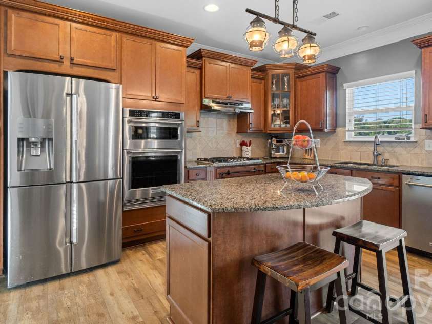 1232 New River Drive, Concord, NC 28025.  MLS# CAR4436783, YatesRealty ID 58494. Upgraded chef's kitchen with island seating