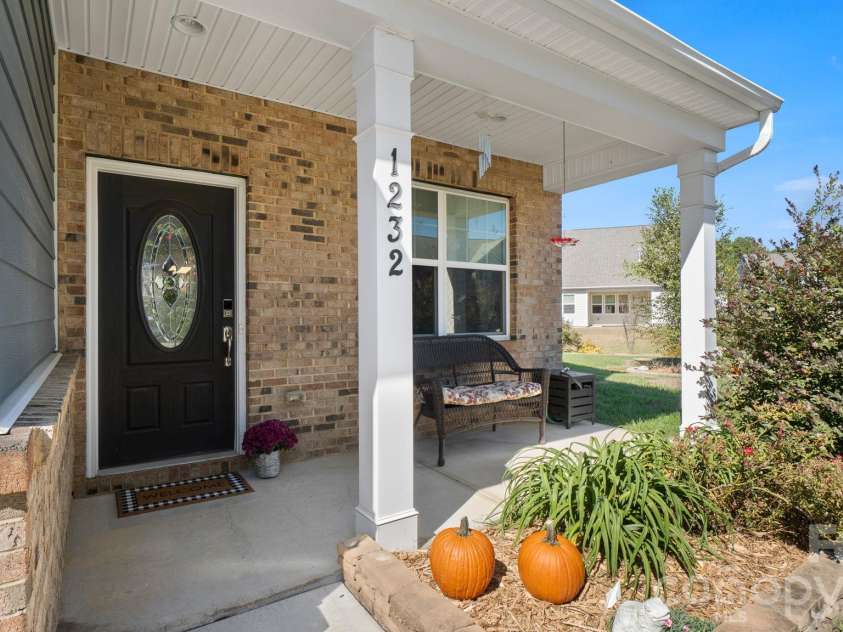 1232 New River Drive, Concord, NC 28025.  MLS# CAR4436783, YatesRealty ID 58494. Welcoming covered front porch