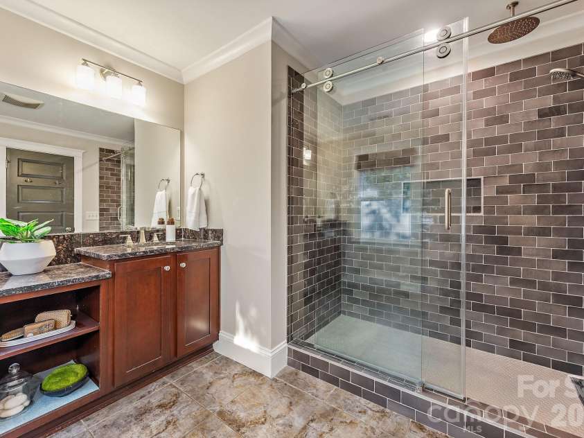 3315 Holt Street, Charlotte, NC 28205.  MLS# CAR4437036, YatesRealty ID 58517. Upper level primary bathroom with walk in shower