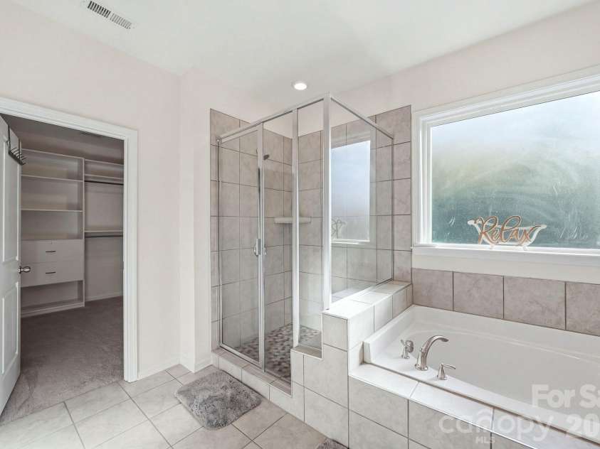 4603 Monument Valley Drive, Indian Land, SC 29707.  MLS# CAR4433542, YatesRealty ID 58574. Spa like bathroom