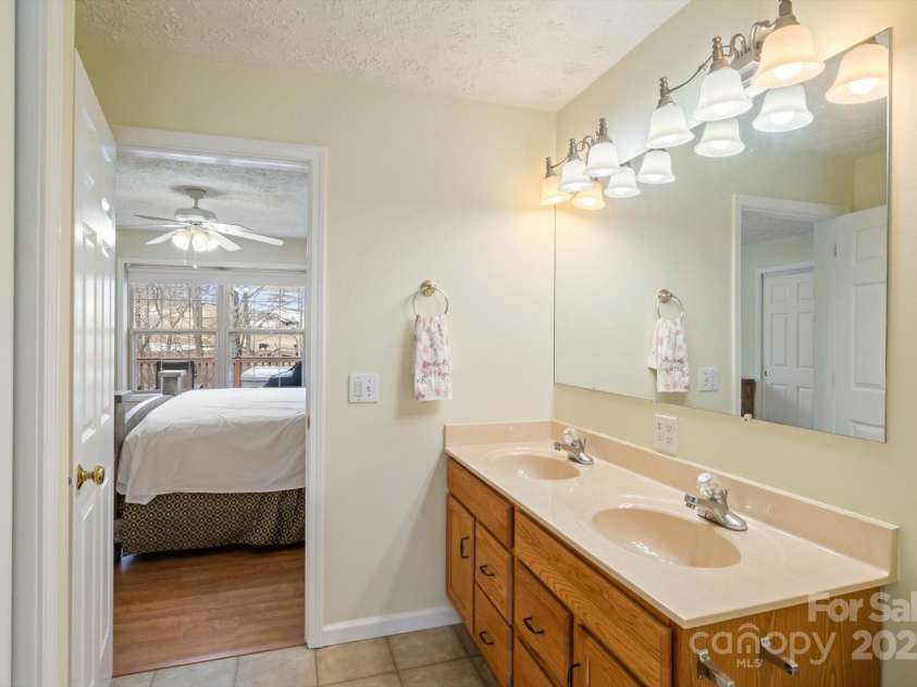 284 Caldwell Drive, Maggie Valley, NC 28751.  MLS# CAR4218982, YatesRealty ID 5858. Primary Bedroom Ensuite