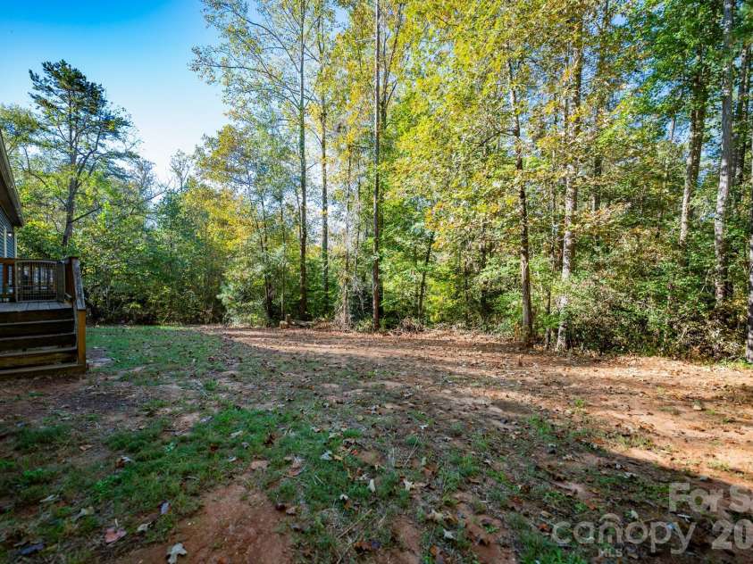 838 Sandy Run Church Road, Mooresboro, NC 28114.  MLS# CAR4434617, YatesRealty ID 58622. Back yard