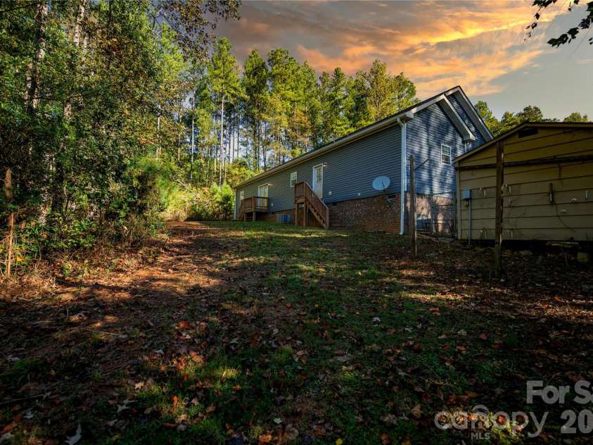 838 Sandy Run Church Road, Mooresboro, NC 28114.  MLS# CAR4434617, YatesRealty ID 58622. Back yard