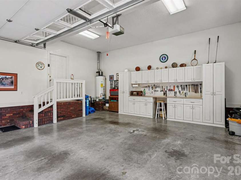 8412 Locksley Drive, Harrisburg, NC 28075.  MLS# CAR4431749, YatesRealty ID 58629. Spacous 2 Car Garage with Custom  BUILT-In Cabients/Work Area.