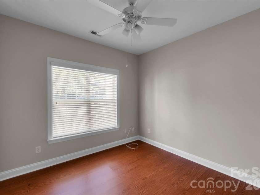 1240 Saint Johns Avenue, Matthews, NC 28104.  MLS# CAR4432333, YatesRealty ID 58630. Front Bedroom