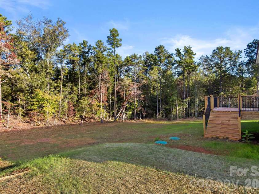 4665 Riverside Road, Lancaster, SC 29720.  MLS# CAR4437789, YatesRealty ID 58648. Sprawling backyard with a deck made for entertaining
