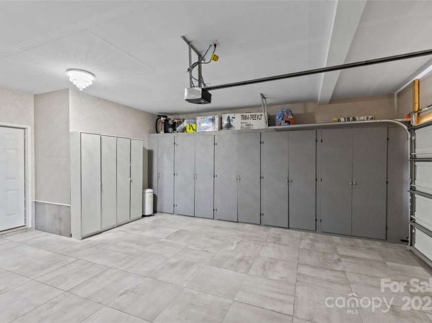 3008 Dundee Lane, Fort Mill, SC 29707.  MLS# CAR4223357, YatesRealty ID 5868. Tile floor and built-in shelving in the garage.