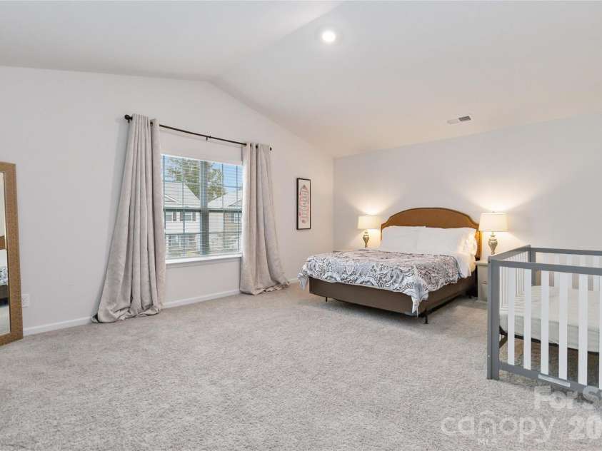 2147 Eastway Drive, Dallas, NC 28034.  MLS# CAR4313585, YatesRealty ID 5895. Primary bedroom with cathedral ceiling