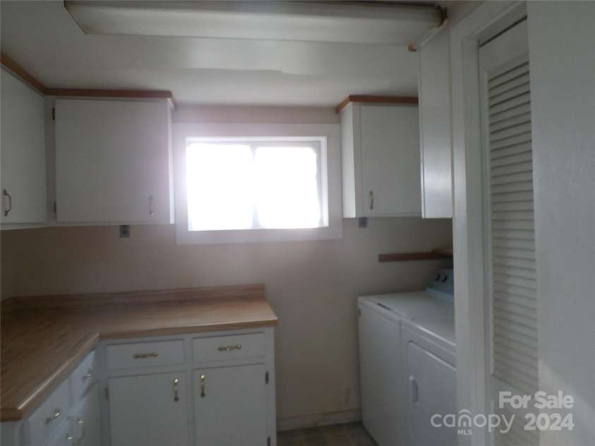 288 Firetower Road, Spruce Pine, NC 28777.  MLS# CAR4135750, YatesRealty ID 5896.  laundry room