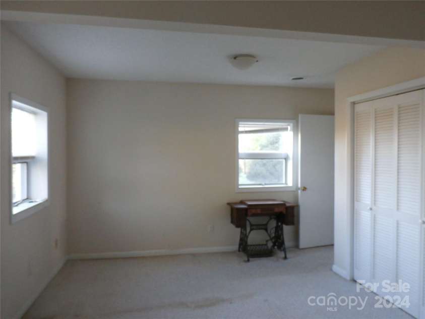 288 Firetower Road, Spruce Pine, NC 28777.  MLS# CAR4135750, YatesRealty ID 5896. Lower level bedroom