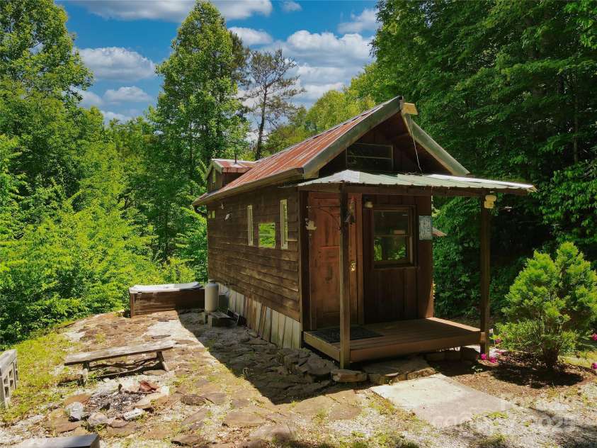 3929 Parker Padgett Road, Old Fort, NC 28762.  MLS# CAR4077370, YatesRealty ID 59. Rustic tiny home nestled in the woods.