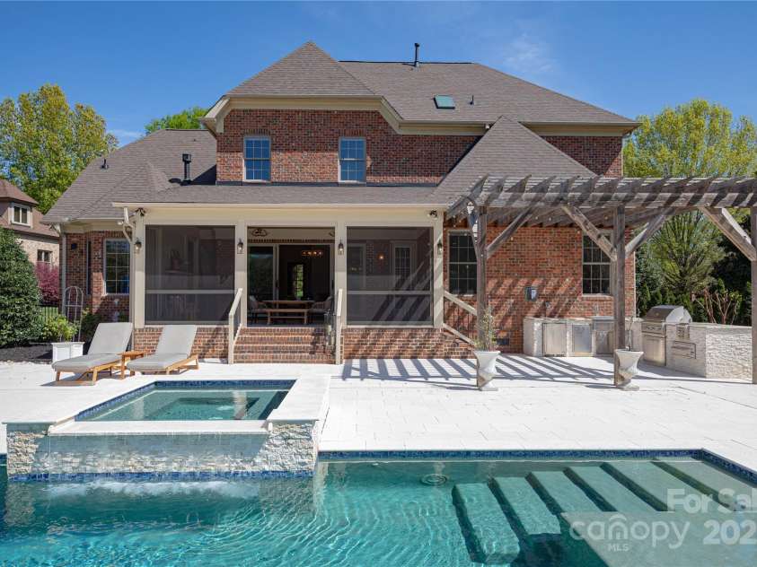 819 Beauhaven Lane, Waxhaw, NC 28173.  MLS# CAR4242522, YatesRealty ID 5915. Hot Tub w/Waterfall Edge & Seating On All Sides