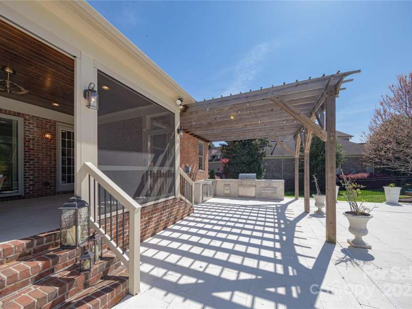 819 Beauhaven Lane, Waxhaw, NC 28173.  MLS# CAR4242522, YatesRealty ID 5915. Outdoor Kitchen w/Pergola adds to Poolside Fun & Convenience