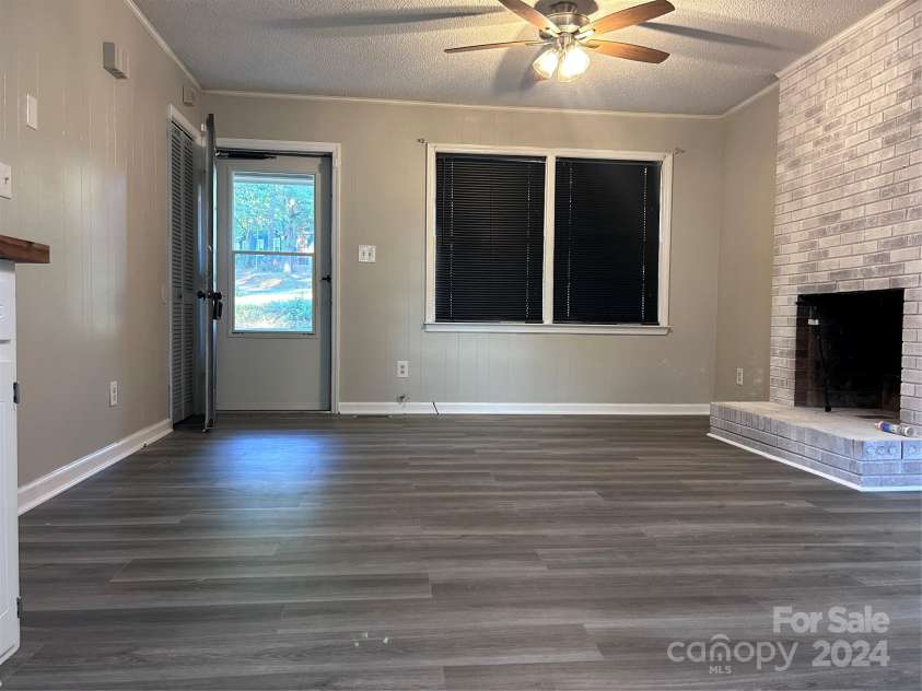 526 Kings Road, Shelby, NC 28150.  MLS# CAR4193837, YatesRealty ID 5924. Living room with new flooring and celing fan
