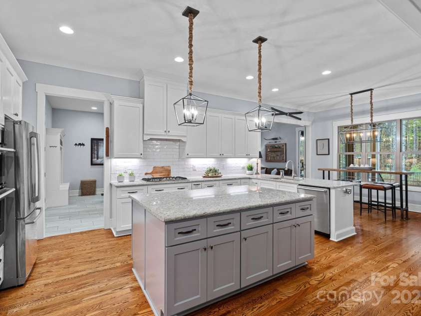 4637 Gold Finch Drive, Denver, NC 28037.  MLS# CAR4243866, YatesRealty ID 5930. Chef's kitchen with huge island, granite countertops, gas range with hood, stainless steel appliances, wall oven, tile backsplash, under cabinet lighting, soft close cabinets, pull outs and more!